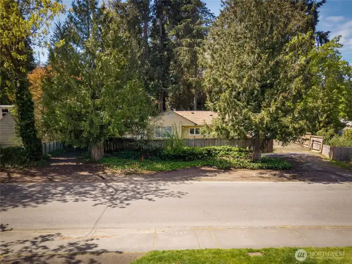 Existing home with 10th Ave. Facing East.