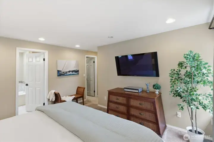 walk in closet and spa like bathroom in primary