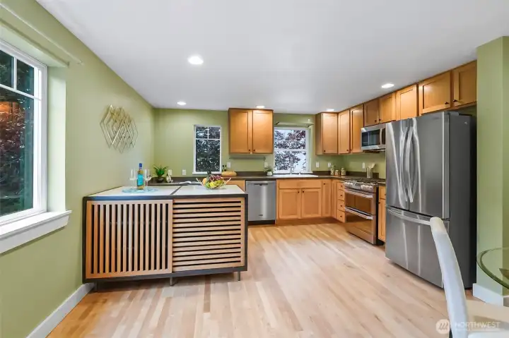 Large kitchen with big marble topped island