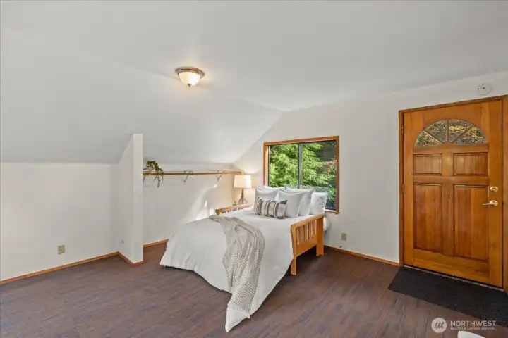 Open loft bedroom area includes natural light, wooded views, and ample flexible living space. Open loft bedroom area includes natural light, wooded views, and ample flexible living space.