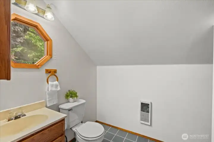 Loft bathroom includes a vanity, natural light window, and clean, functional layout. Loft bathroom includes a vanity, natural light window, and clean, functional layout.