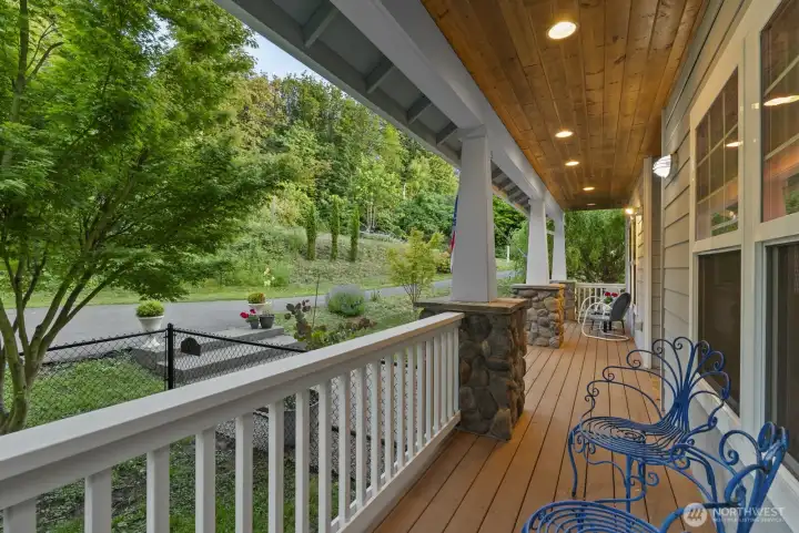 Welcoming covered front porch in serene setting Welcoming covered front porch in serene setting