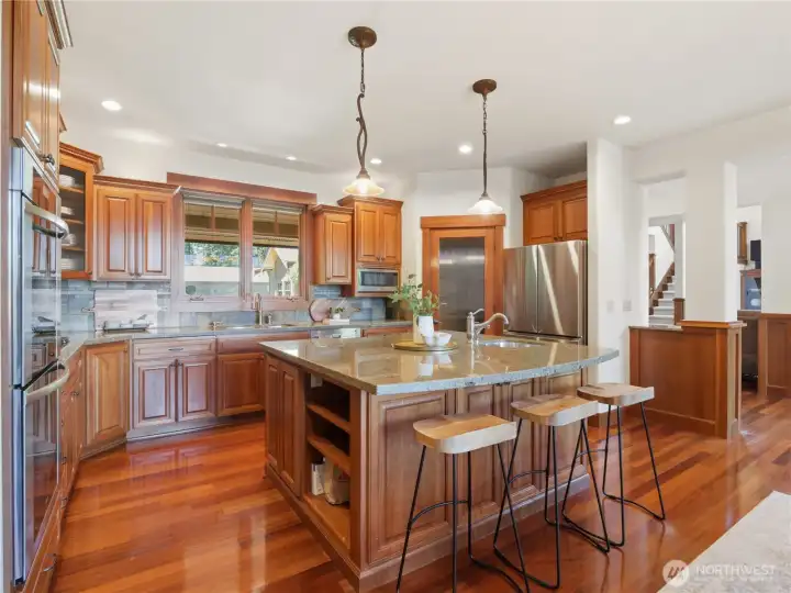 Designed with both everyday living and entertaining in mind, the kitchen features granite countertops, a substantial center island, stainless steel appliances, and abundant cabinetry. Designed with both everyday living and entertaining in mind, the kitchen features granite countertops, a substantial center island, stainless steel appliances, and abundant cabinetry.