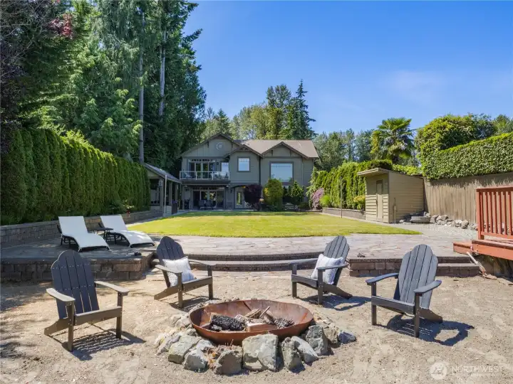 Gather around the fire pit, launch your watercraft from your own dock, or relax on the expansive lawn overlooking the lake. Framed by mature evergreens and designed to embrace its stunning setting, this property offers an exceptional blend of waterfront recreation, outdoor enjoyment, and scenic beauty. Gather around the fire pit, launch your watercraft from your own dock, or relax on the expansive lawn overlooking the lake. Framed by mature evergreens and designed to embrace its stunning setting, this property offers an exceptional blend of waterfront recreation, outdoor enjoyment, and scenic beauty.