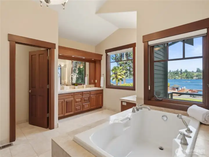 Large windows bring in natural light and showcase the surrounding landscape, while vaulted ceilings contribute to the spacious feel. Large windows bring in natural light and showcase the surrounding landscape, while vaulted ceilings contribute to the spacious feel.