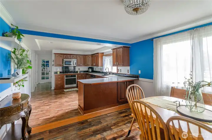 View into the spacious kitchen loads of storage plus counter casual eating bar.