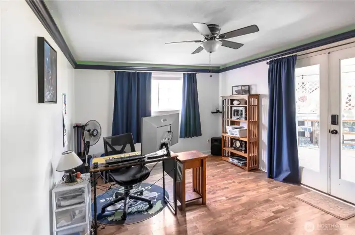 Main floor den currently used as an office.  French doors lead to back patio.
