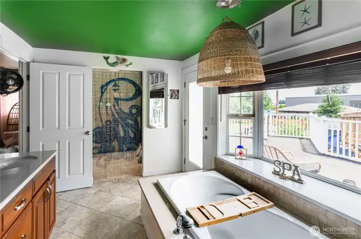 Tiled flooring.  Door leads to upper deck that overlooks the back yard.