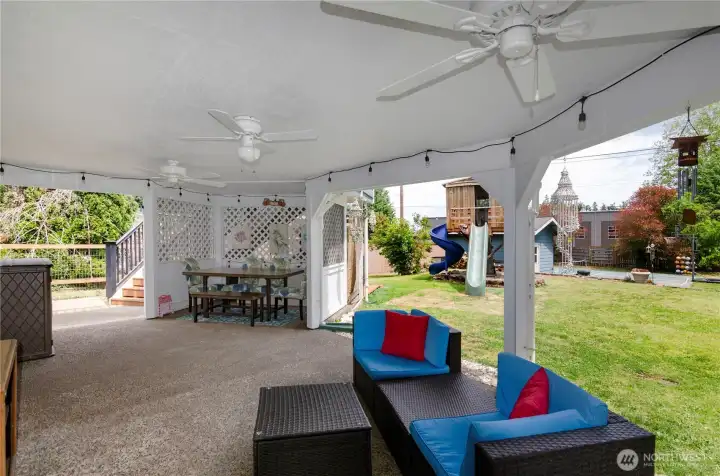 Outdoor dining nook.  Ceiling fans with lights added for evening use as well.