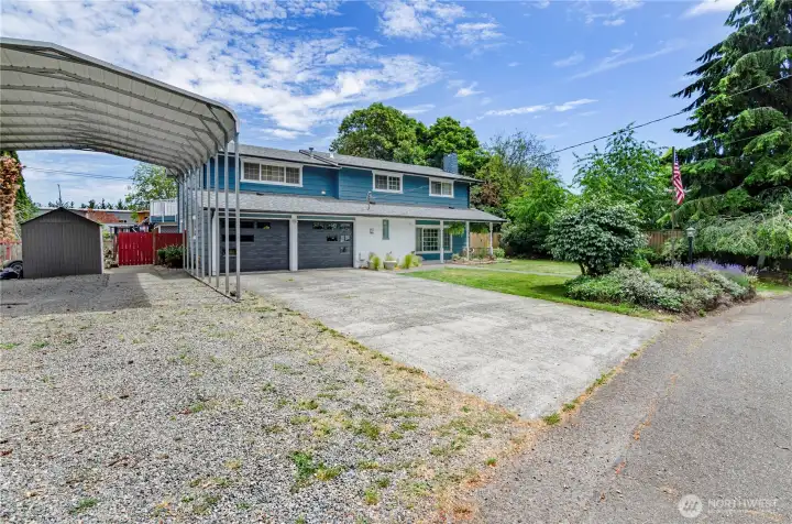 Extra long RV covered storage.  Room to park 4 cars, RV or a boat.  Newer garage doors give a contemporary feel.