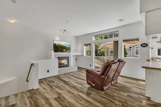 Bright and open living room with fireplace