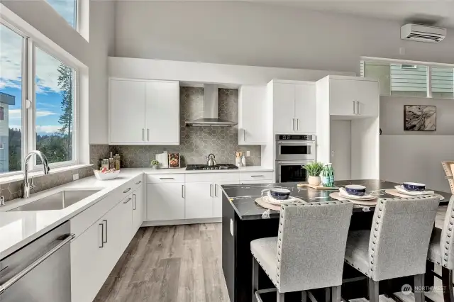 Large kitchen with high ceilings and eating space (all interior photos are from lot 24 model home - same floorplan)