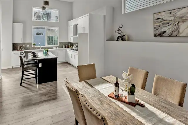 Dining and kitchen space with high ceilings! (all interior photos are from lot 24 model home - same floorplan)