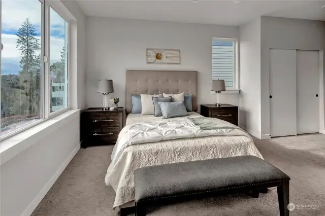 Primary bedroom with big windows for natural light! (all interior photos are from lot 24 model home - same floorplan)