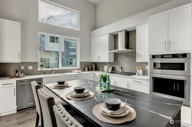 Large kitchen with high ceilings and eating space  (all interior photos are from lot 24 model home - same floorplan)