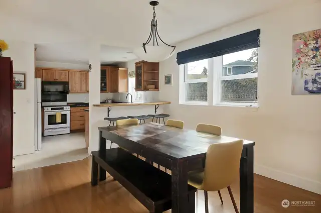 Windows to your right look out upon your expanded deck. There is a hallway to your left, before stepping fully into the kitchen, that leads to the 3rd Bedroom (Bunk Room), 1/2 bath laundry room & garage.