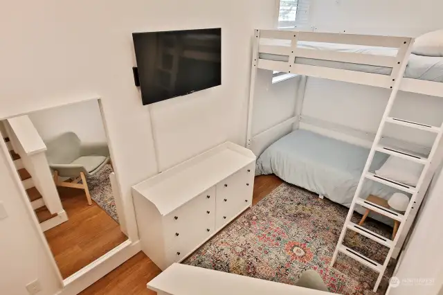 Seller remodeled during their ownership to make this 3rd bedroom (currently lives as a Bunk Room) from space that was previously a two car garage (now an oversized one car garage). A few steps from the hallway and you have this extra bedroom that could be an office, studio space, or workout room.
