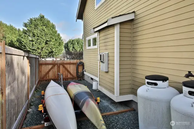Fenced area with your propane tanks (leased) and is a great spot to park your kayaks or other outdoor toys.
