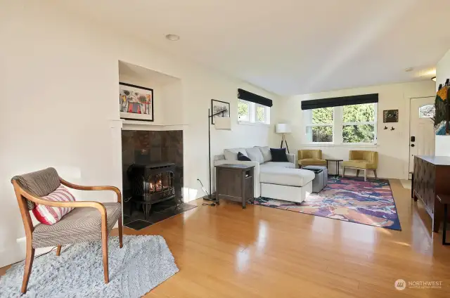 Freestanding propane fireplace provides a sense of coziness and is placed in a great location as a heat source during power outages.
