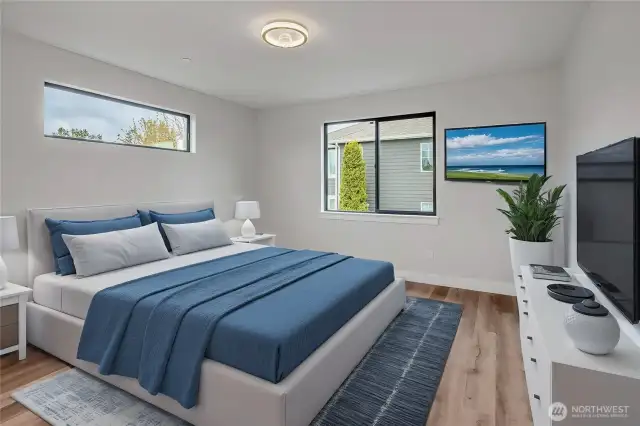 Primary bedroom with lots of space and light!(Different unit, floor plan, & color scheme digitally staged)