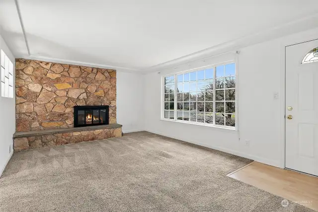 Lots of natural light and a wood burning fireplace.