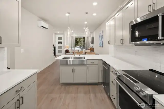 Open concept living/dining/kitchen- high ceilings, AC & tons of natural light