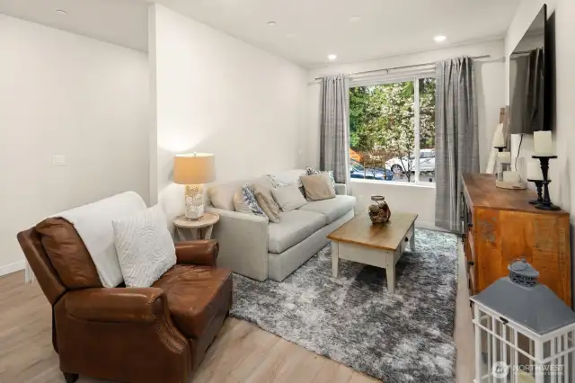 Open concept living/dining/kitchen- high ceilings, AC & tons of natural light