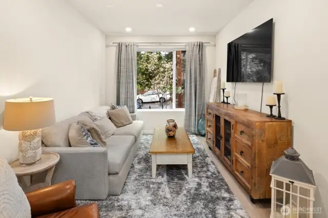 Open concept living/dining/kitchen- high ceilings, AC & tons of natural light