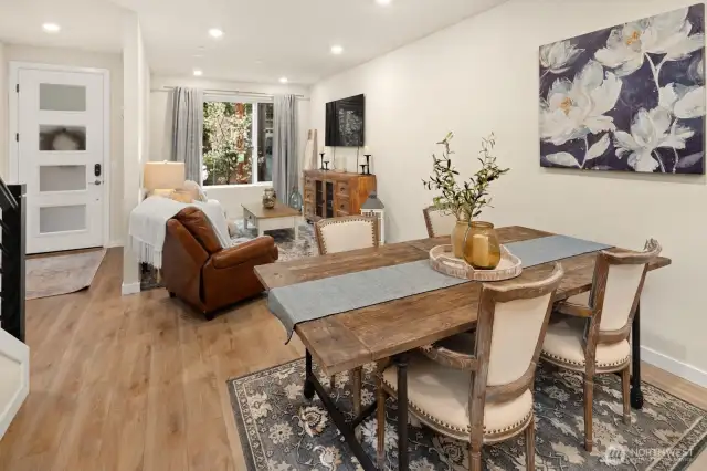 Open concept living/dining/kitchen- high ceilings, AC & tons of natural light