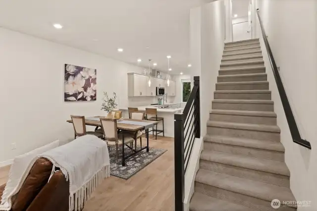 Open concept living/dining/kitchen- high ceilings, AC & tons of natural light
