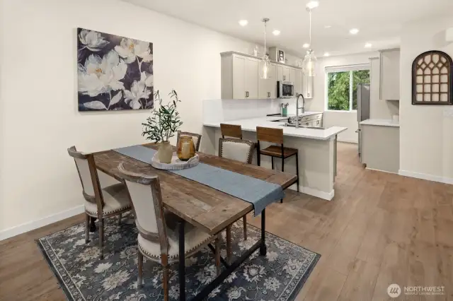 Open concept living/dining/kitchen- high ceilings, AC & tons of natural light
