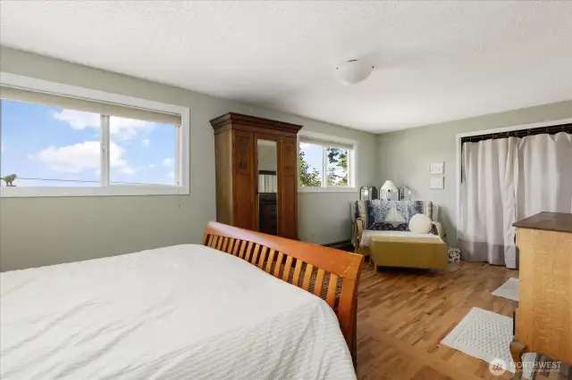Sitting area of primary bedroom. Bedroom has two big closets.