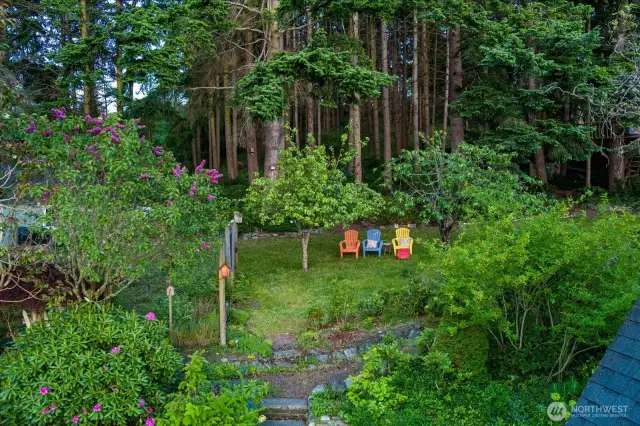 Fenced garden at left and view sitting area behind the house