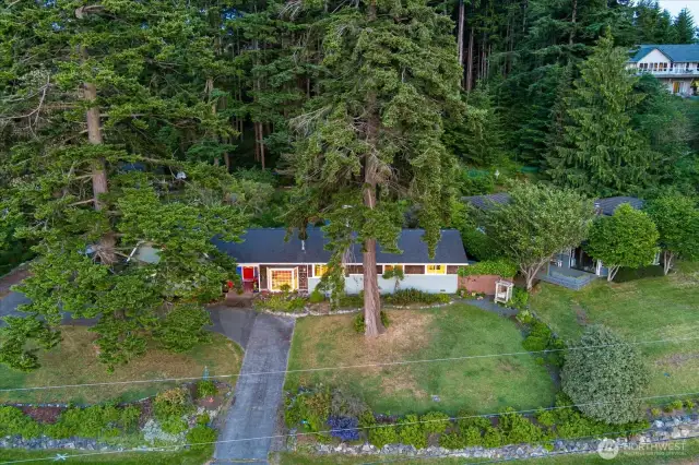 Sited on 3/4 +/- acre of treed loveliness. Property can potentially be subdivided - talk to the town planner.