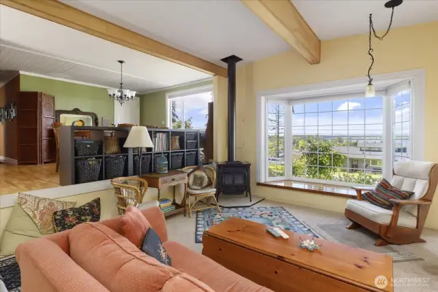 Cozy & inviting living room enjoys heat from the propane stove.
