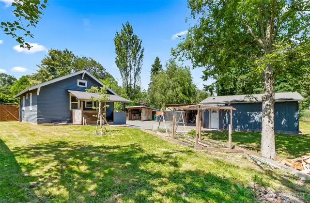 816 sf house with storage sheds and oversized garage that's insulated and wired