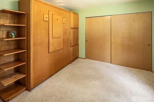 2nd bedroom has a MURPHY BED! Coolest thing ever~it can fold down into an office desk or pull all the way down into a extra bed (see next photo for bed pic)