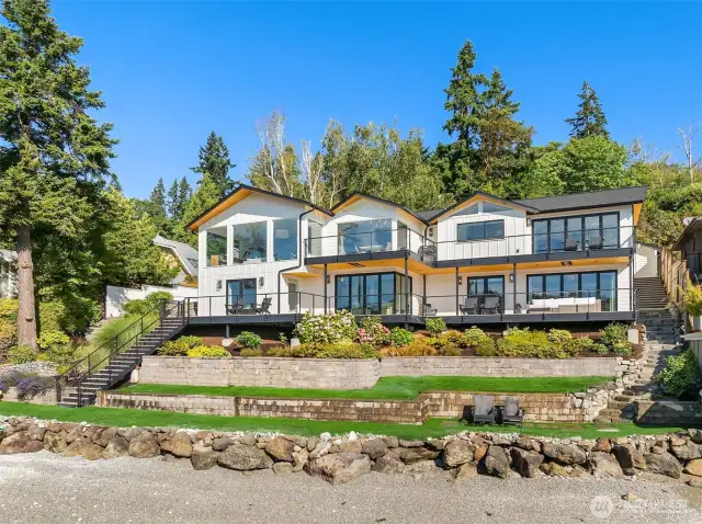 One of the island's finest homes in one of the island's most desirable locations, Point White Drive, offered turn key, fully furnished.