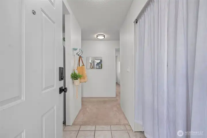 The closet to the right was re-imagined as a pantry and mud-room style. Enjoy custom shelving and a newer microwave!