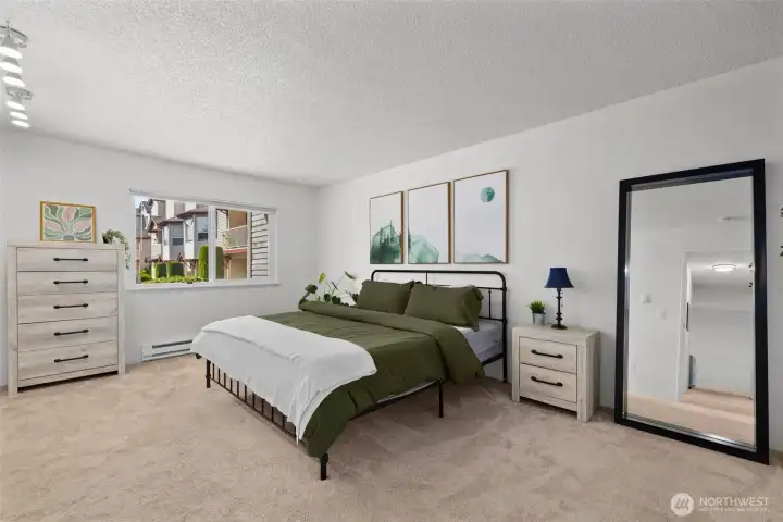 This primary suite is SO large, and this is a King-sized bed