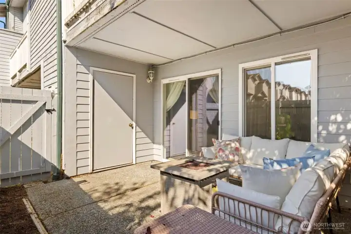 The outside patio has a walk-in storage unit, one of 2 storage spaces!