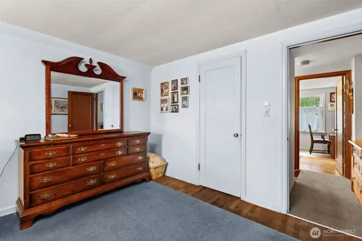 Beneath the rug, the stunning hardwood floors continue, matching the elegance found throughout the house.