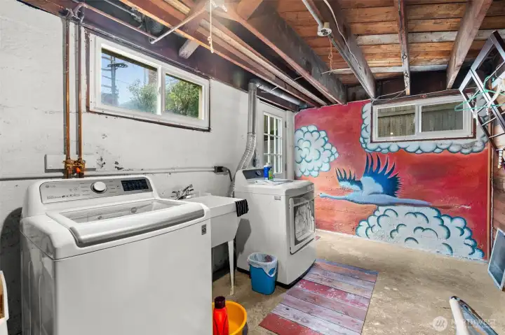 The laundry area is discreetly located in the basement’s rear, minimizing noise and maximizing convenience.