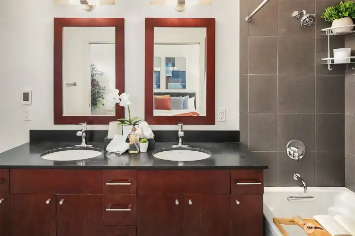 The ensuite primary bath with dual sinks. (photo from previous staging)