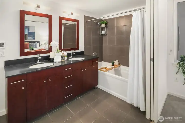 Double pocket doors between the bedroom and ensuite bath. (photo from previous staging)