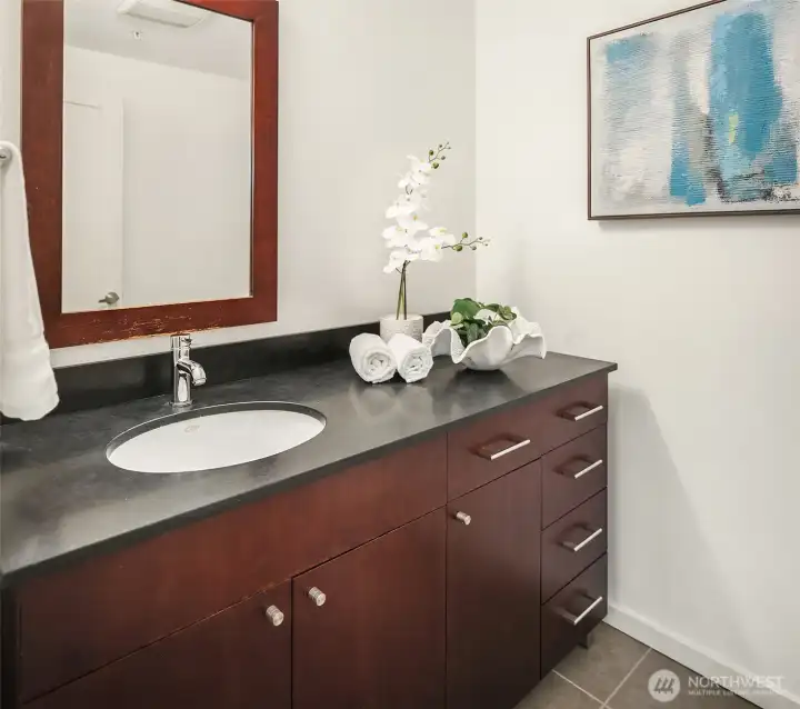 A generously sized half bath for your guests! (photo from previous staging)