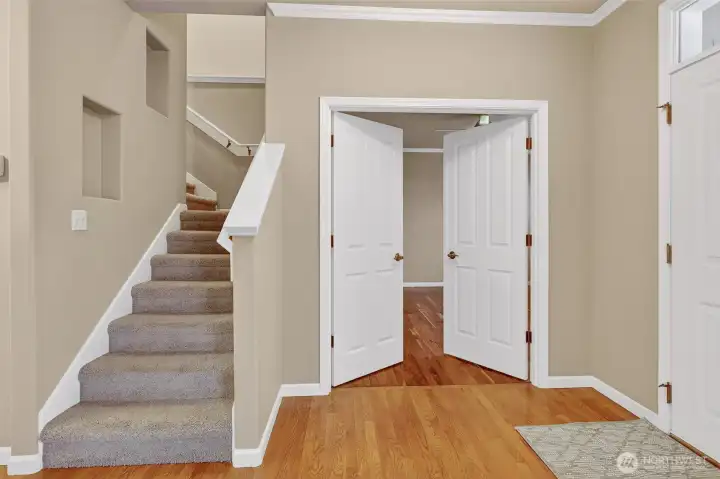 Stairs to second floor and entrance to main floor primary
