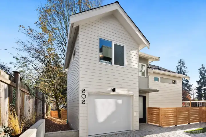 808 is a cottage with garage. The unique floor plan has a sunken living/dining/kitchen and each bedroom is on its own level.