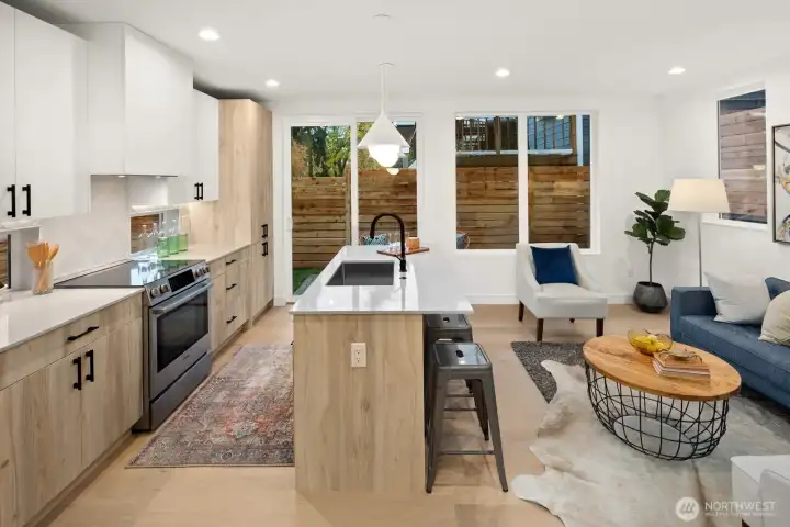 Well appointed island kitchen with stainless appliance package.