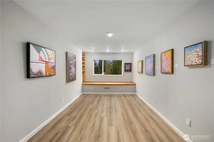 One of three lower floor bedrooms for private and quiet. Full closet and bench seating with additional storage.